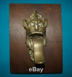 Ancienne sonnette de porte en bronze tête de lion langue articulée curiosité