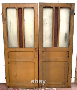 Double portes de passage en verre et sapin patiné XX siècle