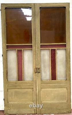 Double portes de passage en verre et sapin patiné XX siècle