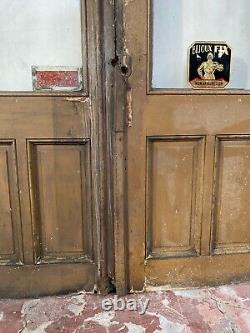 Double portes de passage en verre et sapin patiné XX siècle