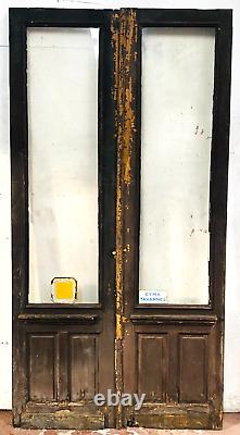Double portes de passage en verre et sapin patiné XX siècle