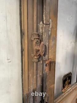 Double portes de passage en verre et sapin patiné XX siècle