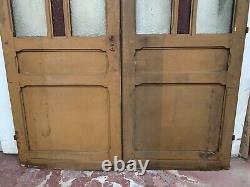 Double portes de passage en verre et sapin patiné XX siècle