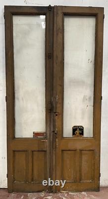 Double portes de passage en verre et sapin patiné XX siècle