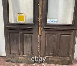Double portes de passage en verre et sapin patiné XX siècle