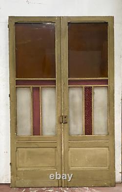 Double portes de passage en verre et sapin patiné XX siècle