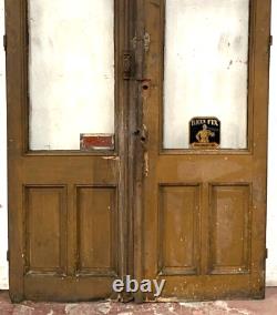 Double portes de passage en verre et sapin patiné XX siècle