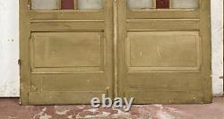 Double portes de passage en verre et sapin patiné XX siècle