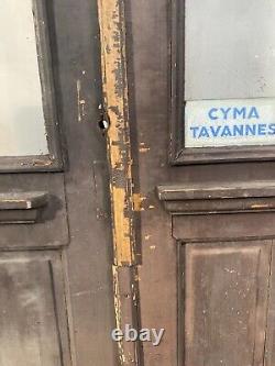 Double portes de passage en verre et sapin patiné XX siècle