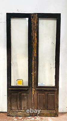 Double portes de passage en verre et sapin patiné XX siècle