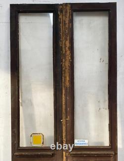 Double portes de passage en verre et sapin patiné XX siècle