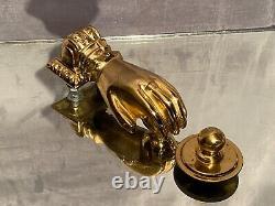 Heurtoir de porte en bronze doré en forme de main de femme