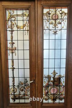 Suite de trois portes de séparation en vitrail a décor floral XX siècle