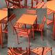 Table De Bistrot Avec Quatre Chaises En Metal Patine Orange. Xx Siècle